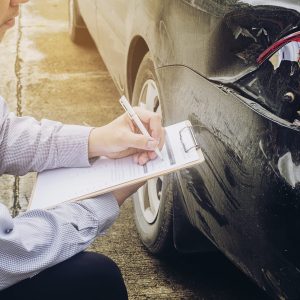 Insurance agent working on car accident claim process